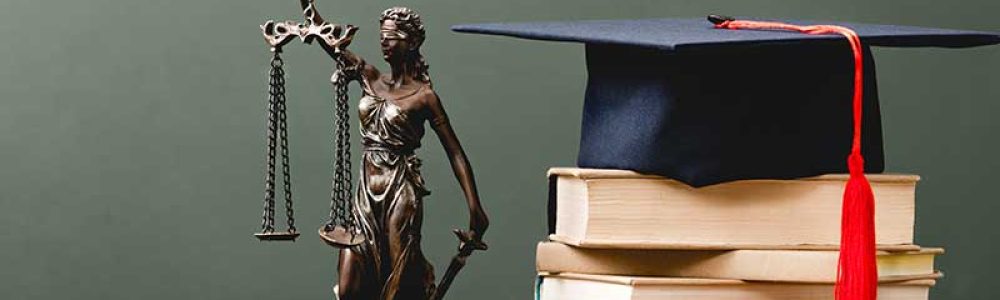 stack-of-books-themis-statuette-and-academic-cap-o-W6NYUBA.jpg